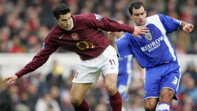 Chris Barker (right) challenges Arsenal's Robin Van Persie