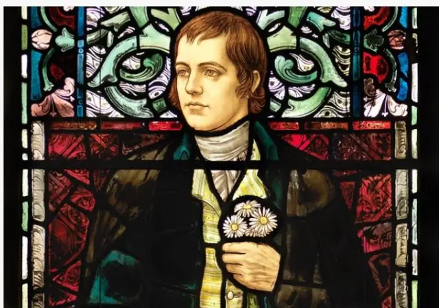 The stained glass portrait of Robert Burns found in the Bute Hall