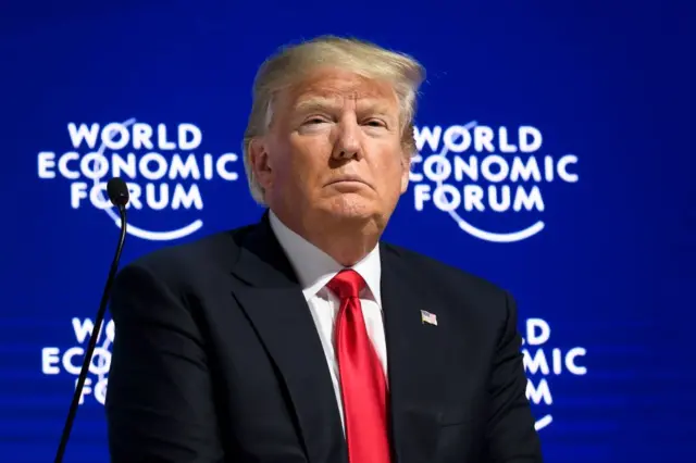 US President Donald Trump looks on during a discussion after delivering his speech during the World Economic Forum in 2018