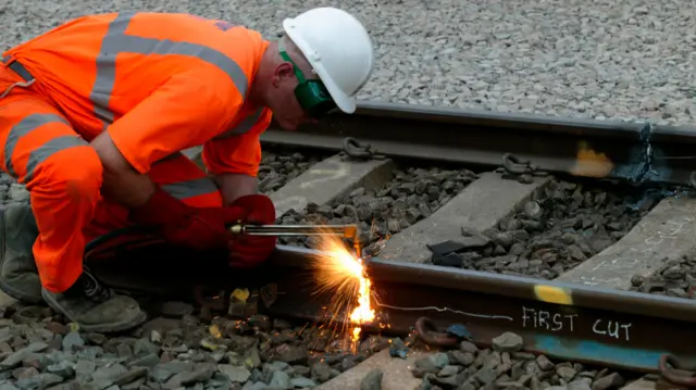 A man cuts track