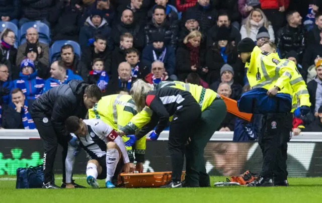 St Mirren captain Kyle Magennis is put on a stretcher