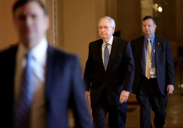 Republican leader Mitch McConnell walks the Senate halls earlier on Wednesday