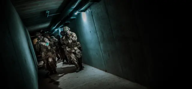 Soldiers in a tunnel