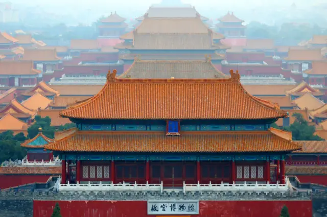 A view of China's forbidden city, showing the ornate rooftops stretching into the distance