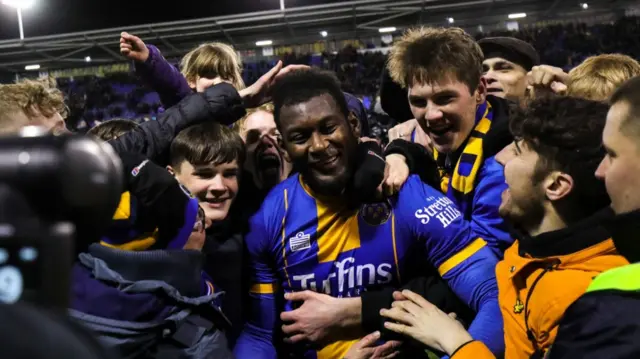 Shrewsbury Town players and fans