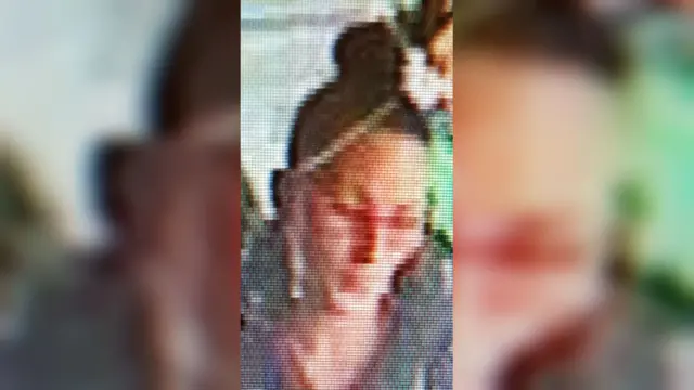 CCTV IMAGE OF WOMAN