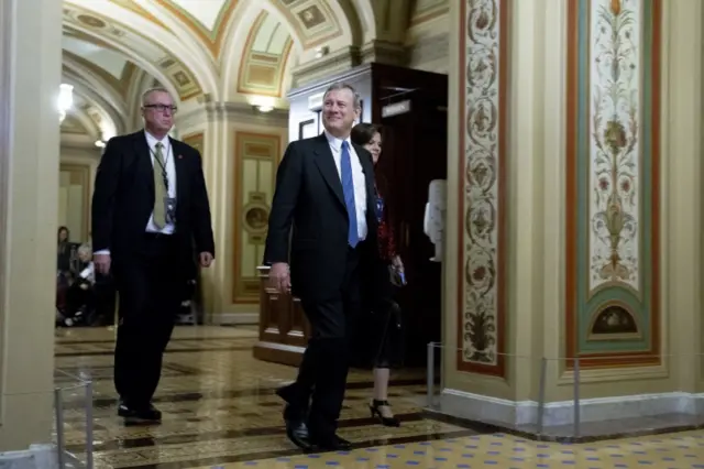 Chief Justice of the United States John Roberts (C) arrives for the Senate impeachment trial