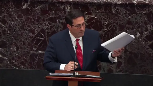 Jay Sekulow holding up a document