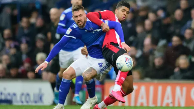 Lincoln City's Tyreece John-Jules vies for possession with Ipswich Town's Luke Chambers