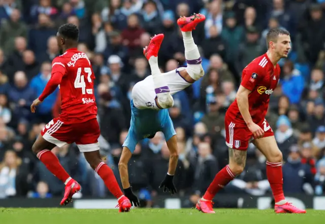 Manchester City's Riyad Mahrez tumbles during the match