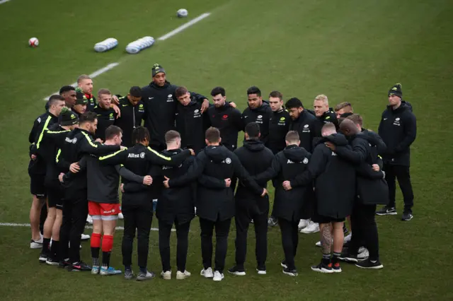 Saracens players in a huddle