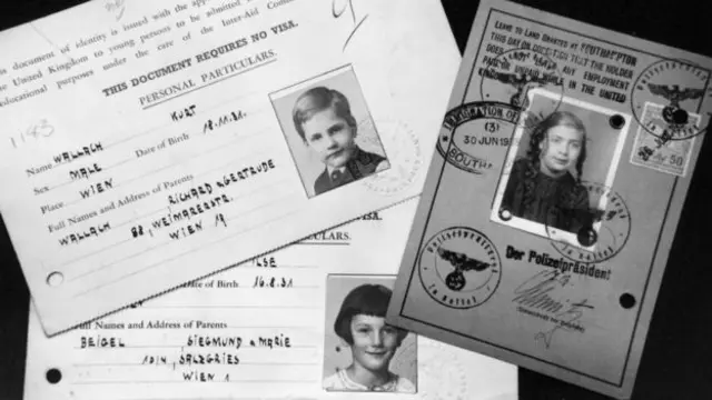 This picture shows the travel documents for three children who were brought to Britain from Austria to escape the Nazis