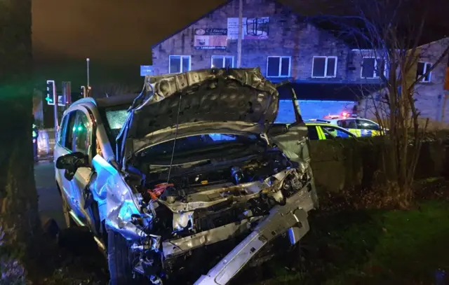 Car in graveyard