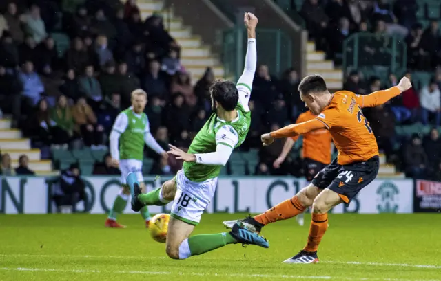 Lawrence Shankland hammers in the opening goal at Easter Road