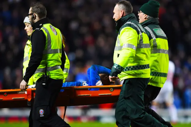 Jermain Defoe is carried off at Ibrox