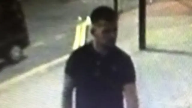 A CCTV image of a man