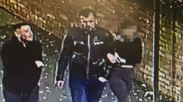 A CCTV image of a man