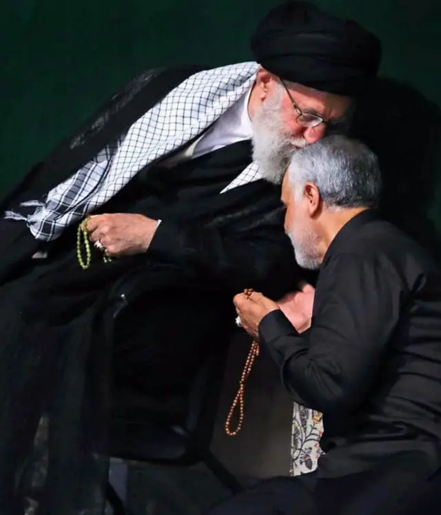 Iranian Supreme Leader Ayatollah Ali Khamenei (L) greeting Iranian Revolutionary Guards Corps (IRGC) Lieutenant general and commander of the Quds Force Qasem Soleimani (R