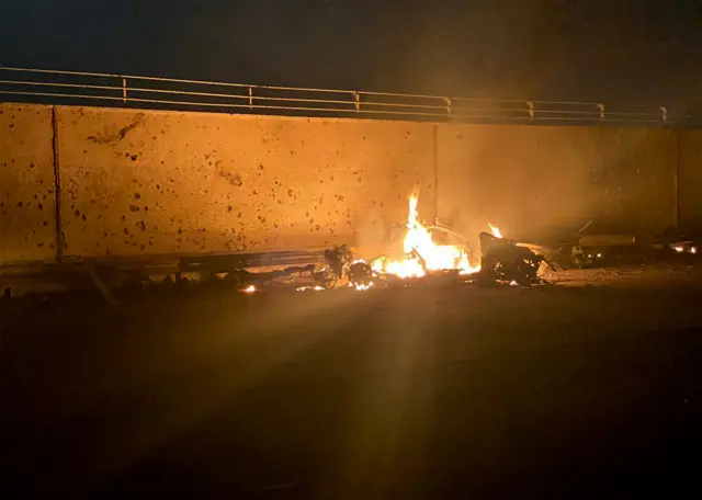 A picture published by the media office of the Iraqi military's joint operations forces shows what they said was a destroyed vehicle on fire following a US strike on 03 January, 2020.