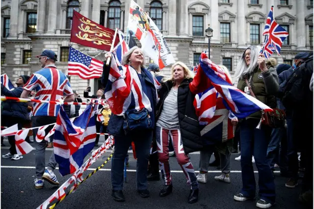 Leave supporters head towards Parliament Square in London.