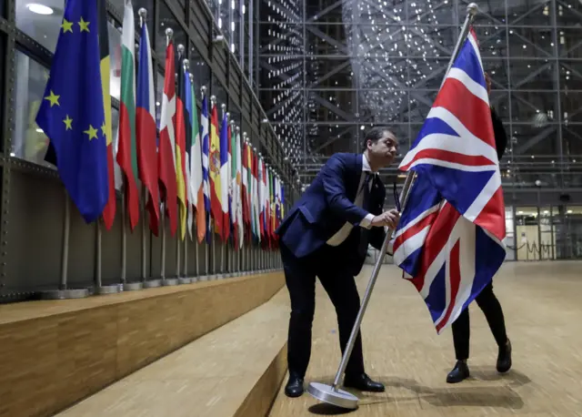 Officials remove the British flag at European Council in Brussels on 31 January 2020