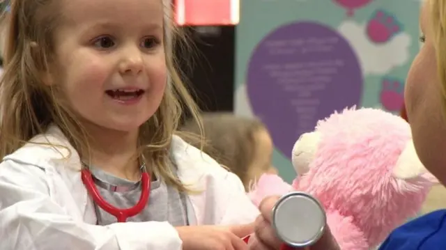 Young girl with teddy bear