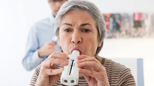 A woman using a measuring device