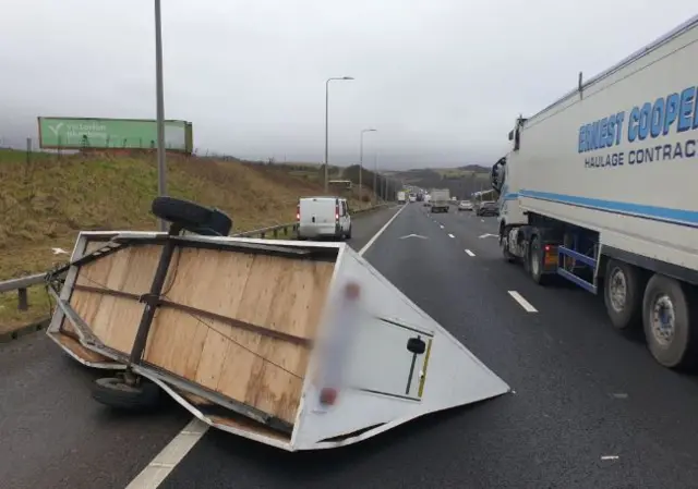 TRAILER BLOWN OVER