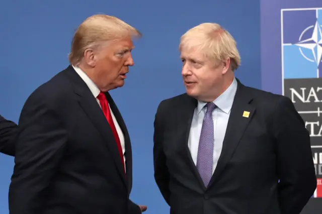 US President Donald Trump and British Prime Minister Boris Johnson stand on stage during the annual Nato heads of government summit in December 2019.