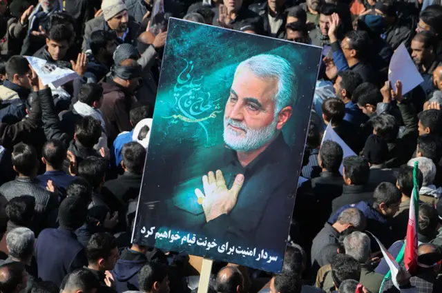 Iranian mourners gather during the final stage of funeral processions for Qasem Soleimani