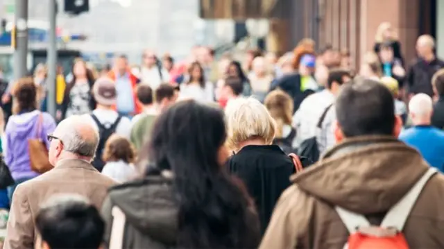 People in street seen from behind