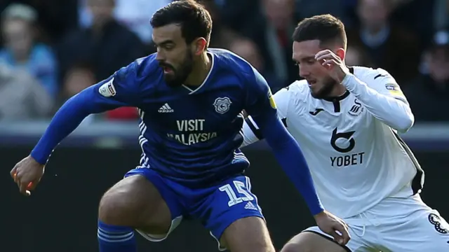 Cardiff's Marlon Pack (left) challenges Matt Grimes of Swansea