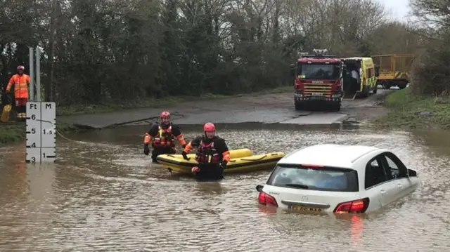 Car stuck in flooding on Watery Gate Lane