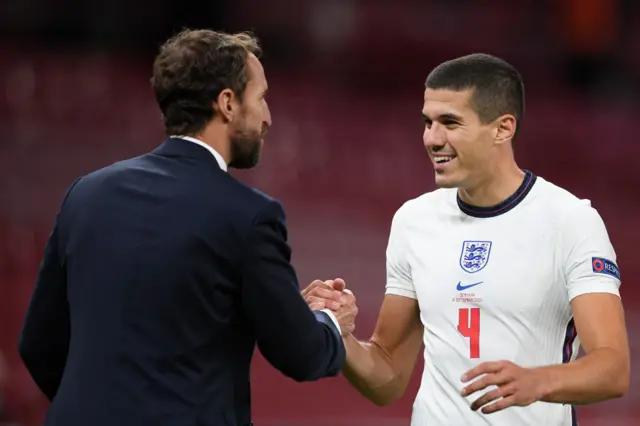 Conor Coady shaking hands with Gareth Southgate after an England game