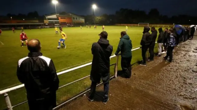 Fans attend a non-league match