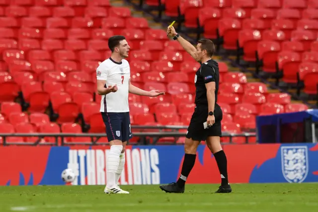 Declan Rice is shown a yellow card