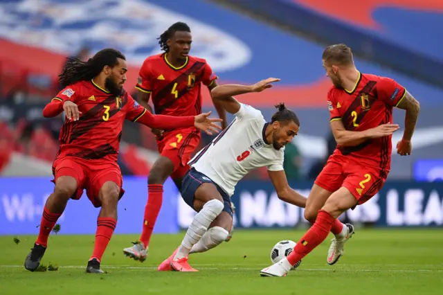 Dominic Calvert- Lewin is surrounded by Belgium defenders