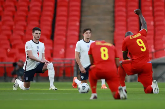 Declan Rice and the Belgium players take the knee before the game at Wembley