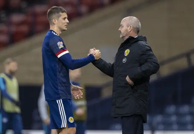 Steve Clarke with goalscorer Lyndon Dykes