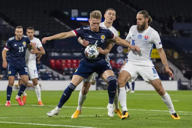 Scotland's Scott McTominay holds off two Slovakians