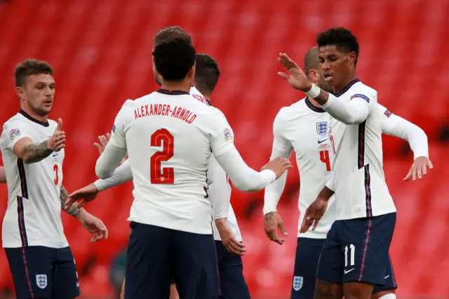 Marcus Rashford celebrates scoring from the penalty spot against Belgium