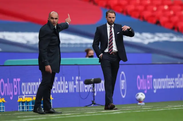 Gareth Southgate and Roberto Martinez give instructions to their sides