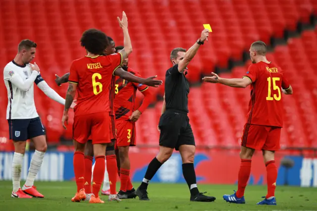 homas Meunier of Belgium is shown the yellow card by Tobias Stieler