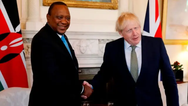 Britain's Prime Minister Boris Johnson (L) with President Uhuru Kenyatta in London,.