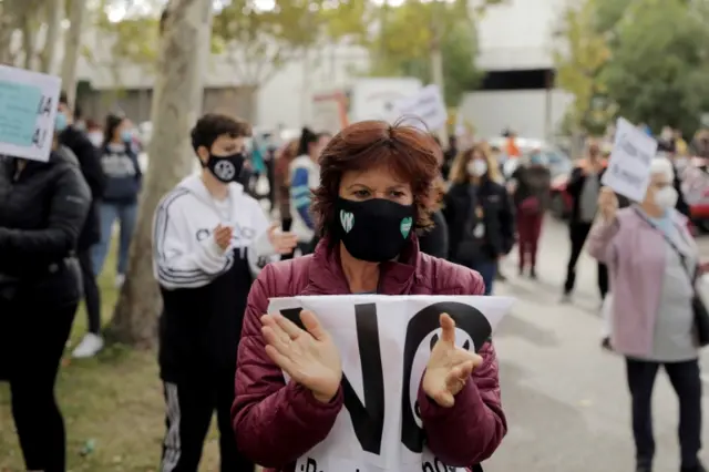 A demonstrator attends a protest against the regional government's measures to control the spread of the coronavirus disease (COVID-19), at Vallecas neighbourhood in Madrid, Spain, October 4, 2020.