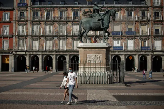 People in Madrid wear face masks as a precaution against the coronavirus (Covid-19) pandemic