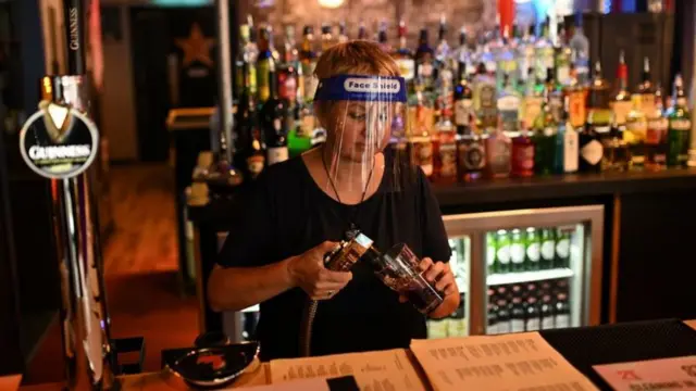 Woman pours pint