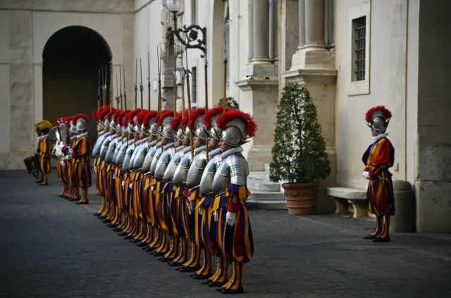 Papal Swiss Guards stand at attention during the swearing-in ceremony at the San Damaso Courtyard in Vatican City, 04 October 2020