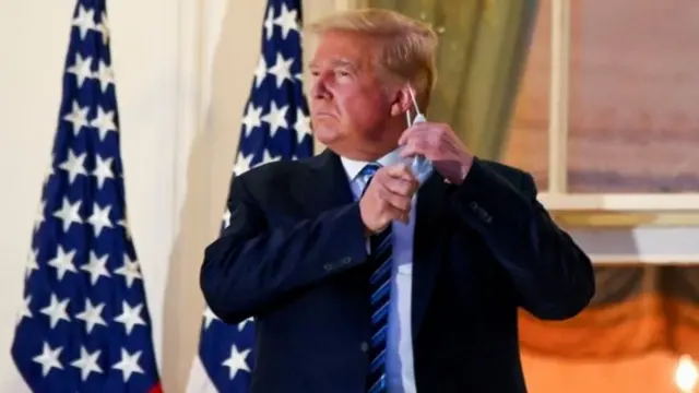 Trump takes mask off