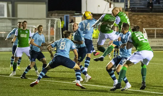 David Gray heads in the winner for Hibs